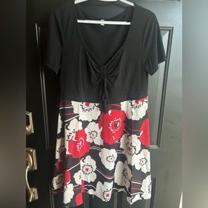 Women’s knee length red and white flower dress.